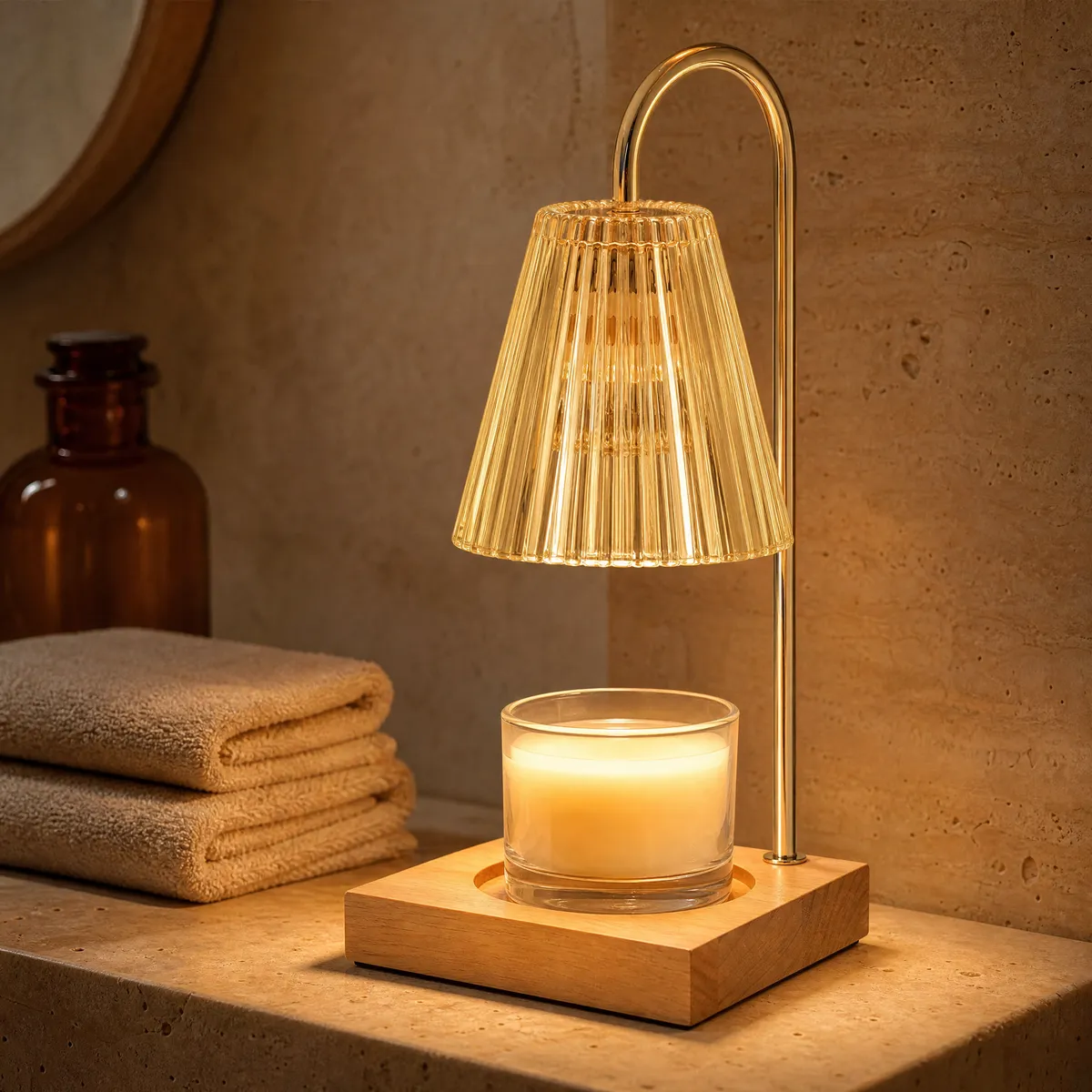 Vintage candle warmer lamp with amber ribbed glass shade on a bathroom shelf